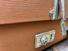 Selection of Four Well-Travelled Suitcases-Auction Lot