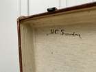 Selection of Four Well-Travelled Suitcases-Auction Lot