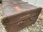 Selection of Four Well-Travelled Suitcases-Auction Lot
