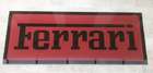 A Ferrari-themed Celluloid Garage-Type Wall Sign-Sold