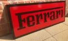 A Ferrari-themed Celluloid Garage-Type Wall Sign-Sold