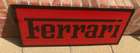 A Ferrari-themed Celluloid Garage-Type Wall Sign-Sold