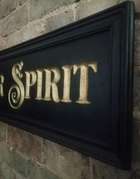 A Beautiful Hand-Carved Wooden 'Motor Spirit' Wall Sign -Sold
