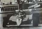 Seven Large Format Photographic Prints of Racing Ferraris Through the Years