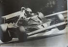 Seven Large Format Photographic Prints of Racing Ferraris Through the Years