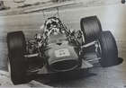 Seven Large Format Photographic Prints of Racing Ferraris Through the Years