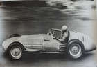 Seven Large Format Photographic Prints of Racing Ferraris Through the Years