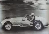 Seven Large Format Photographic Prints of Grand Prix Ferraris Through the Years