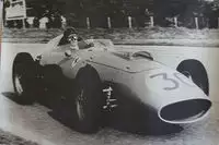 Seven Large Format Photographic Prints of Grand Prix Ferraris Through the Years