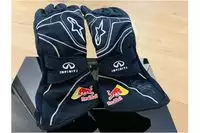 A Pair of Red Bull Gloves signed by Sebastian Vettel