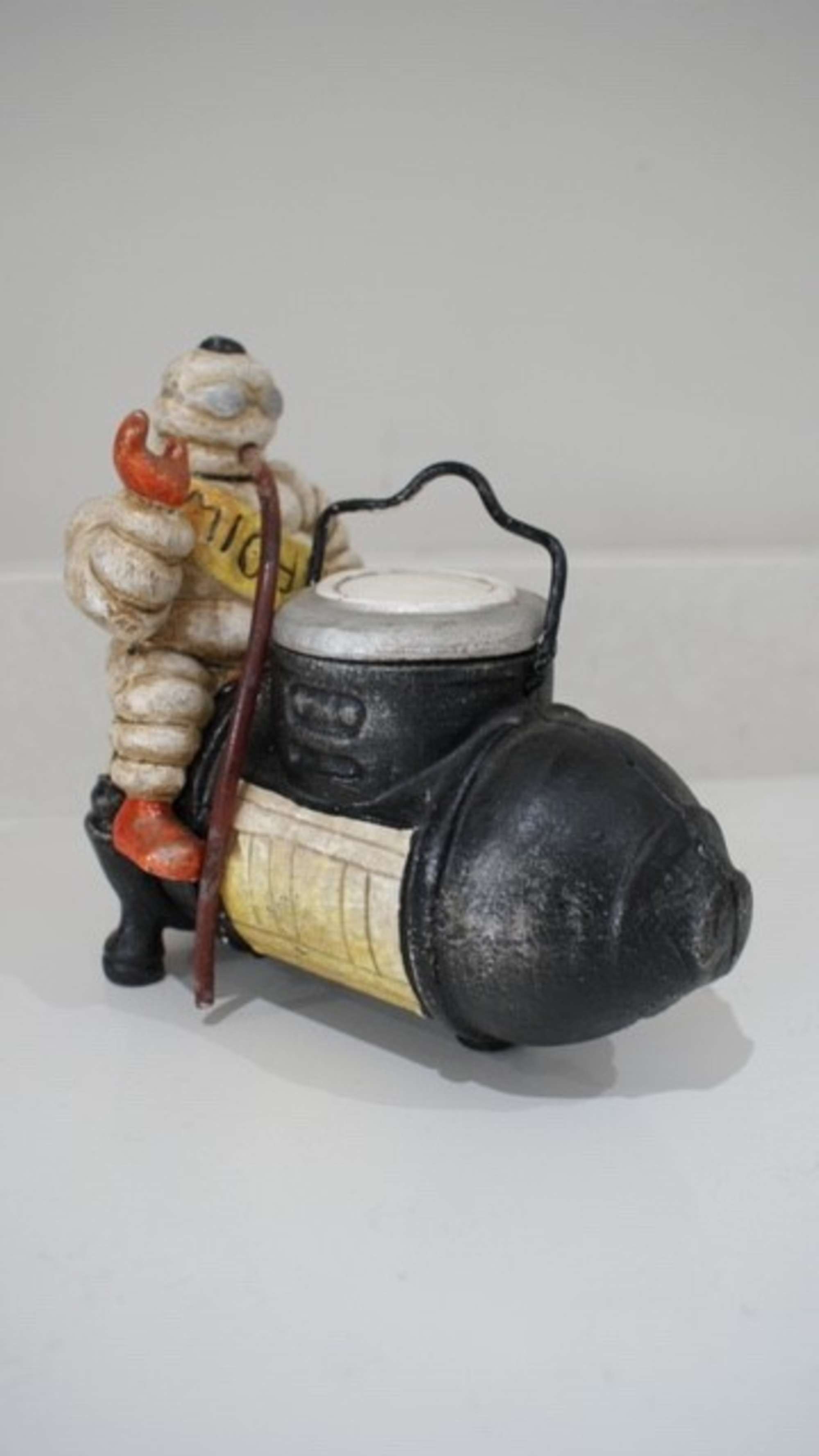 'Michelin Man on compressor' figure.-Sold