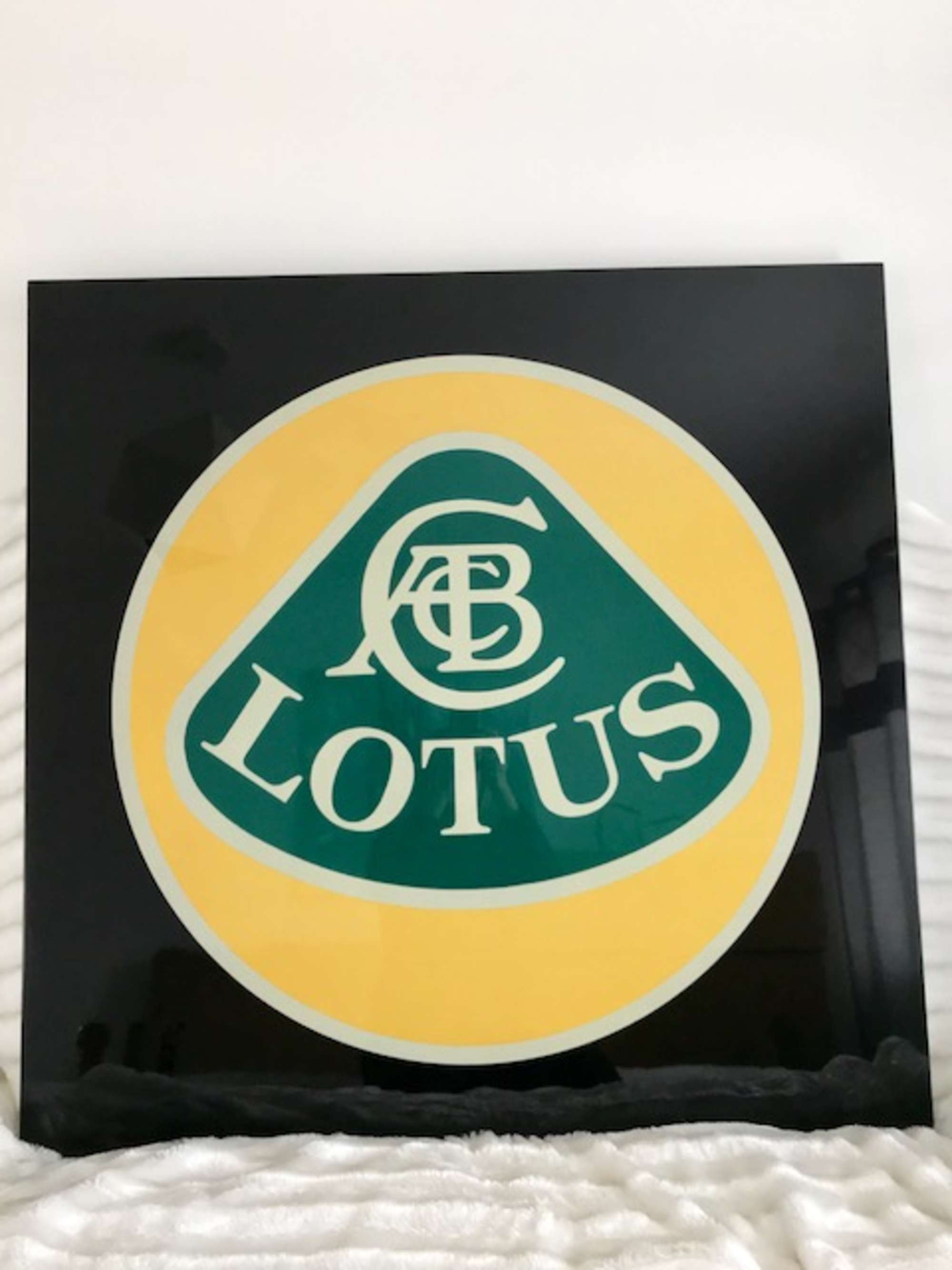 Lotus lacquered sign.-Sold