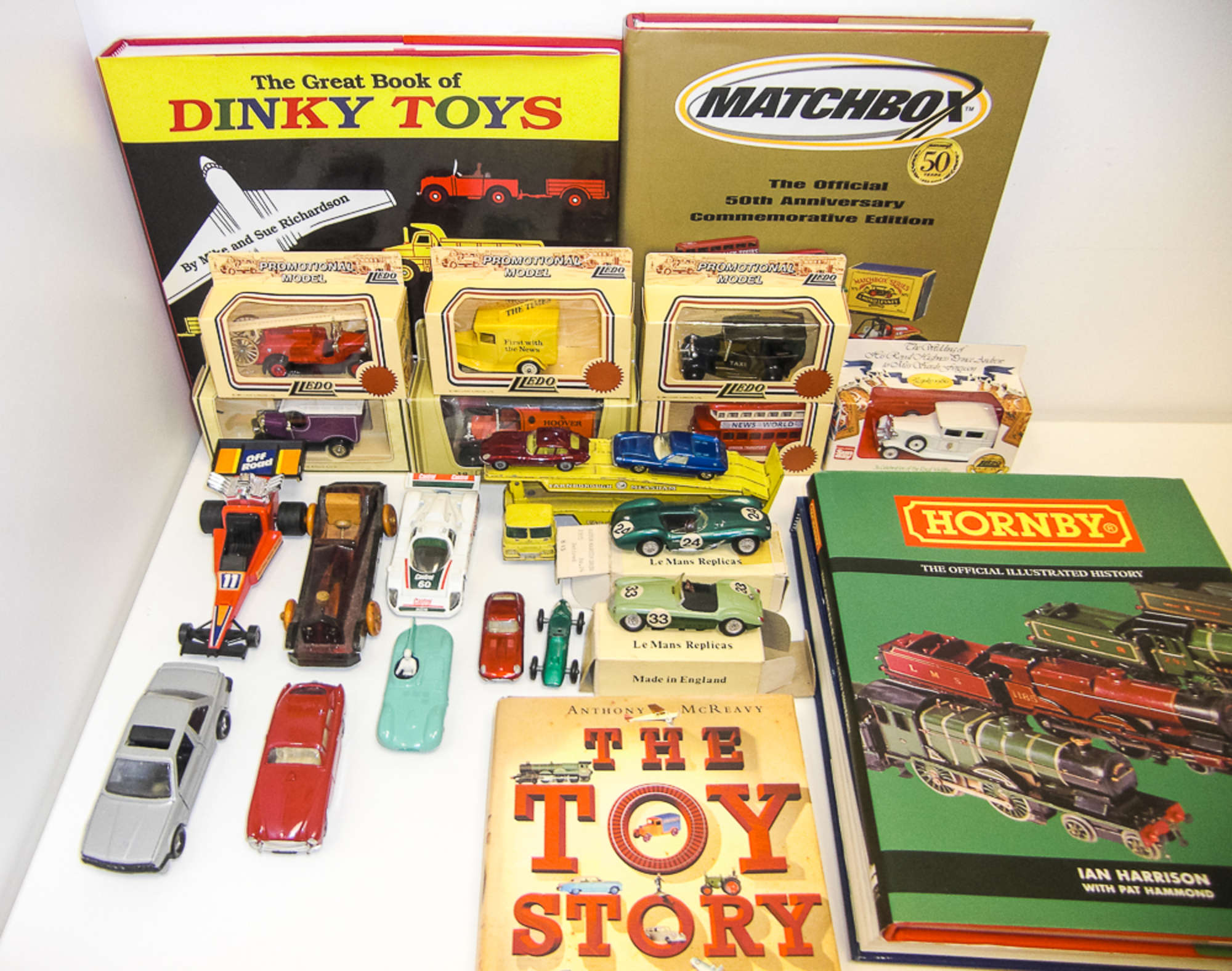 Mixed Lot of Boxed Model Cars and Assorted Books-Sold