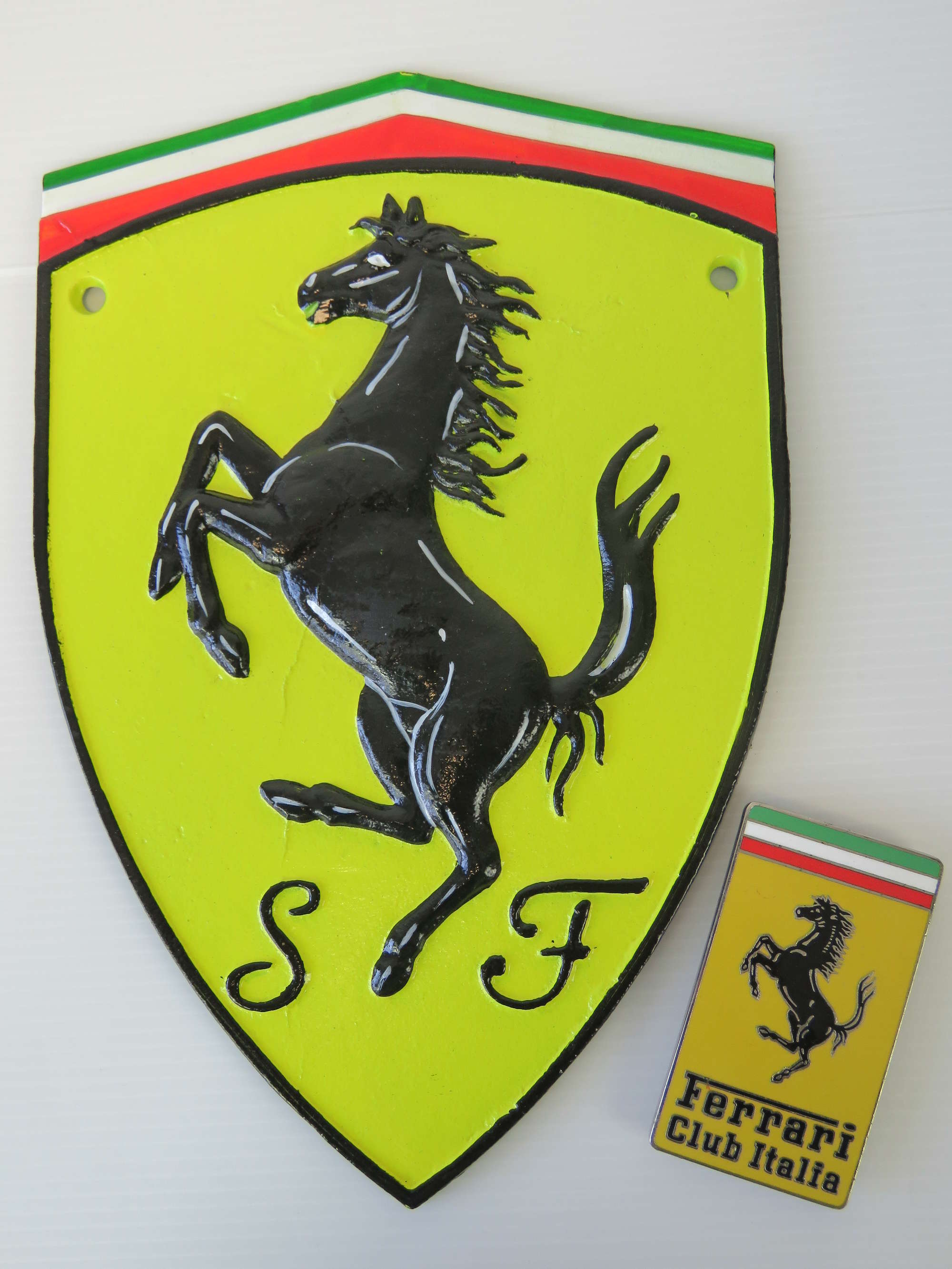 Enamelled 'Ferrari Club Italia' car badge.-Sold