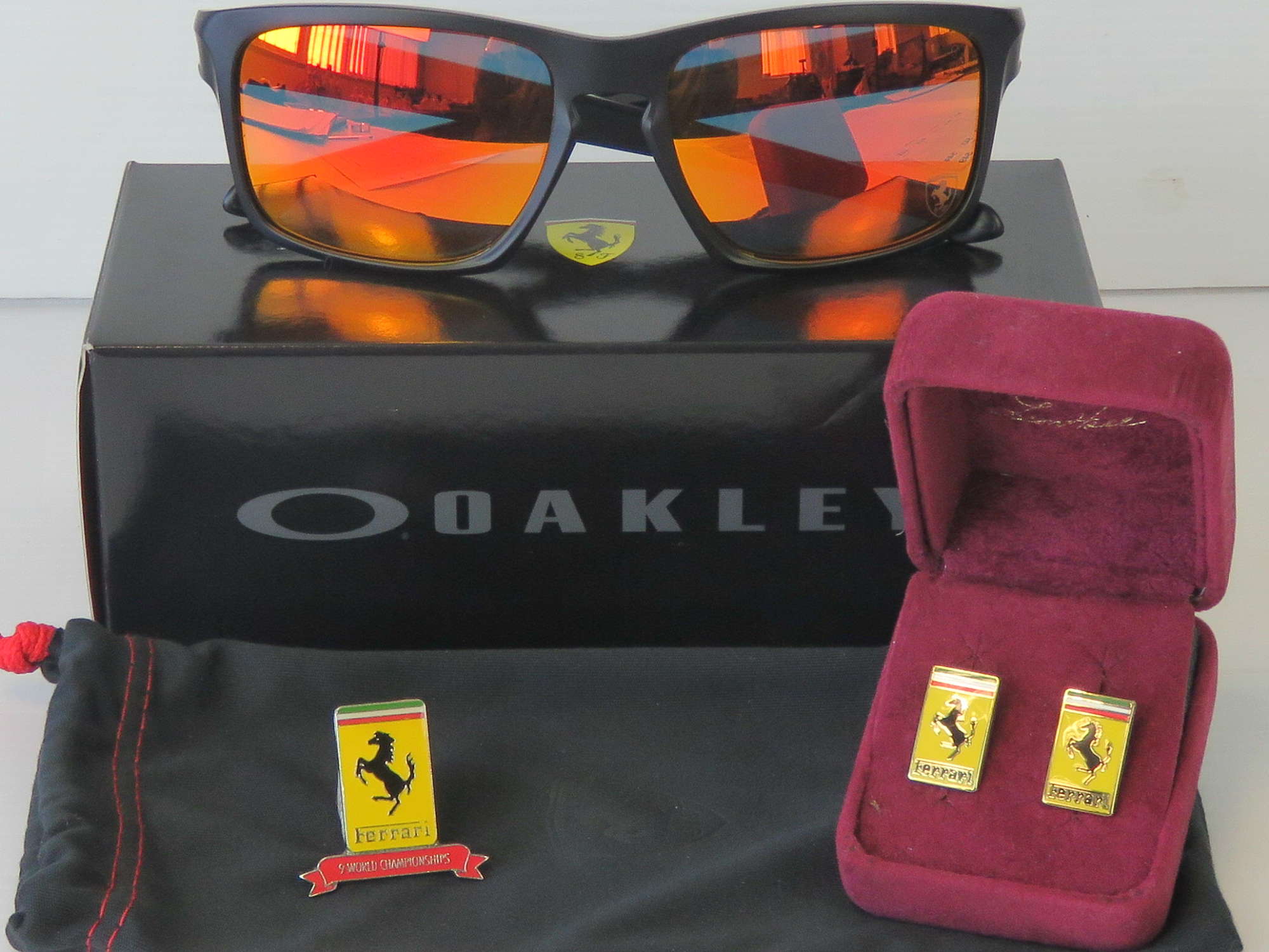 Ferrari sunglasses, cufflinks, and lapel badge-Sold