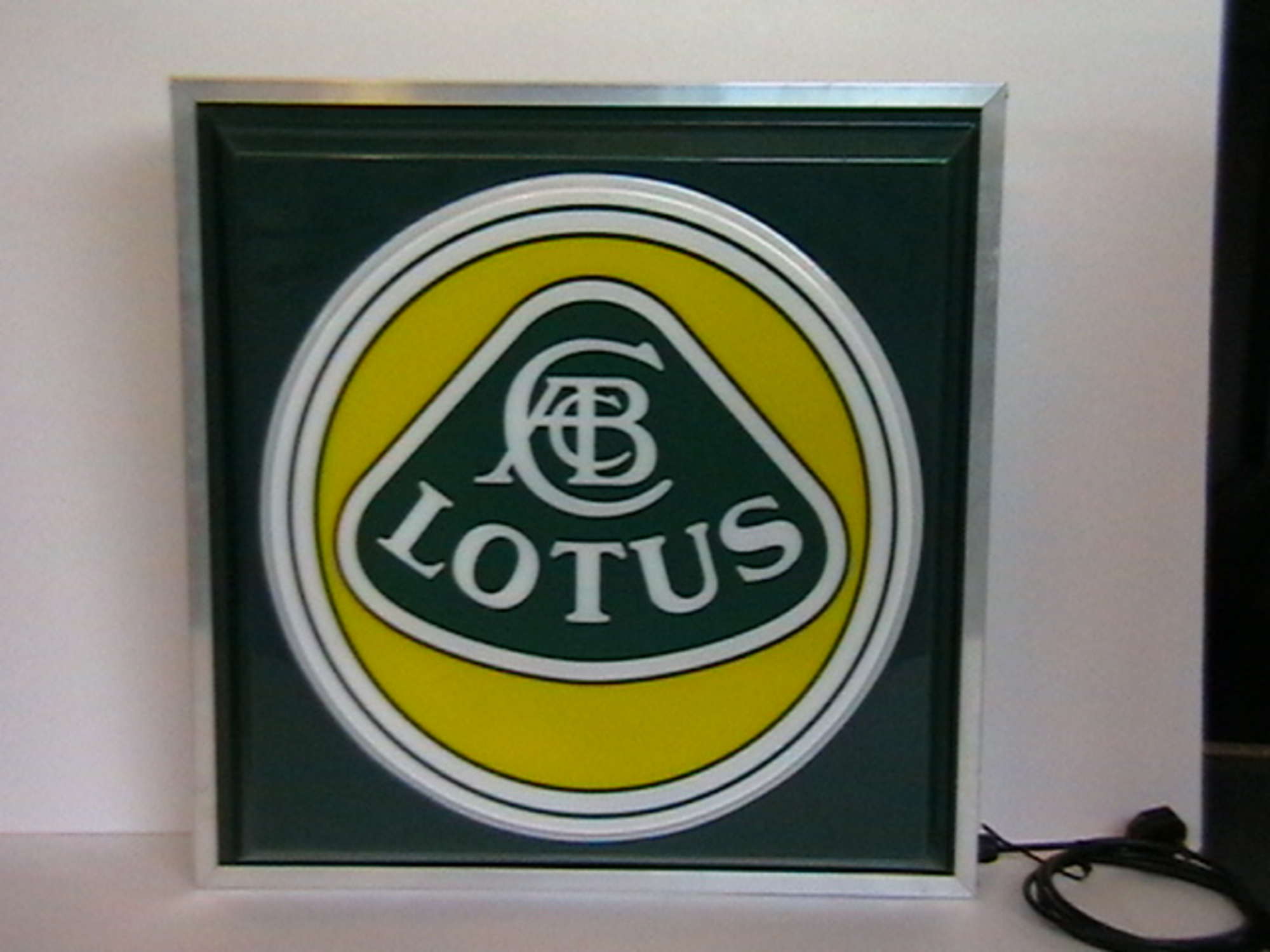 Lotus illuminated wall sign.-Sold