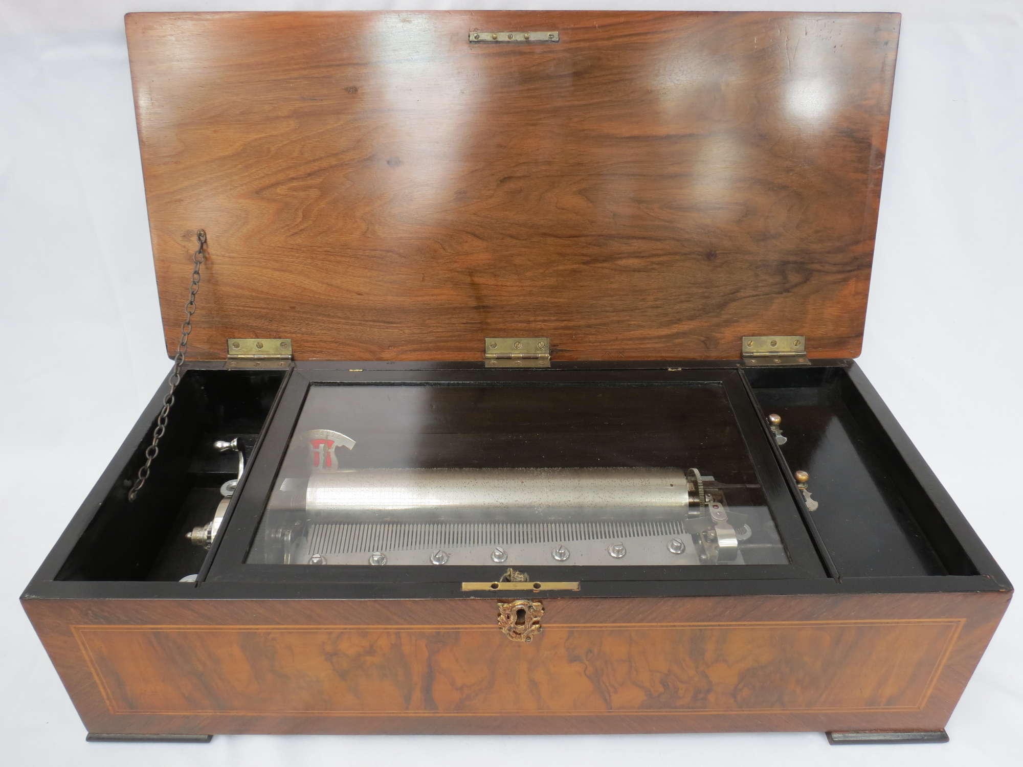 An antique Swiss, rosewood and crossbanded cased 'Eight Airs-Auction Lot