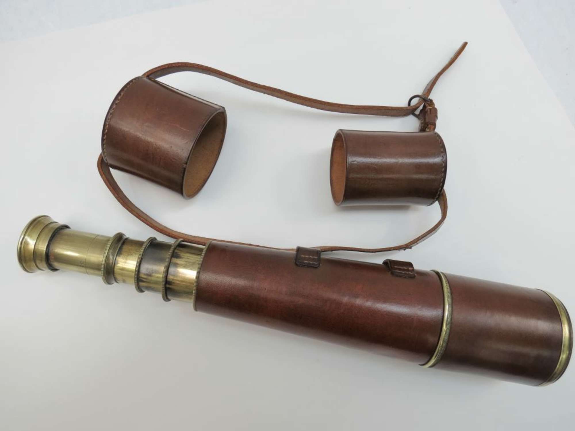 A fine four drawer and single drawer sunshade brass and leat-Auction Lot