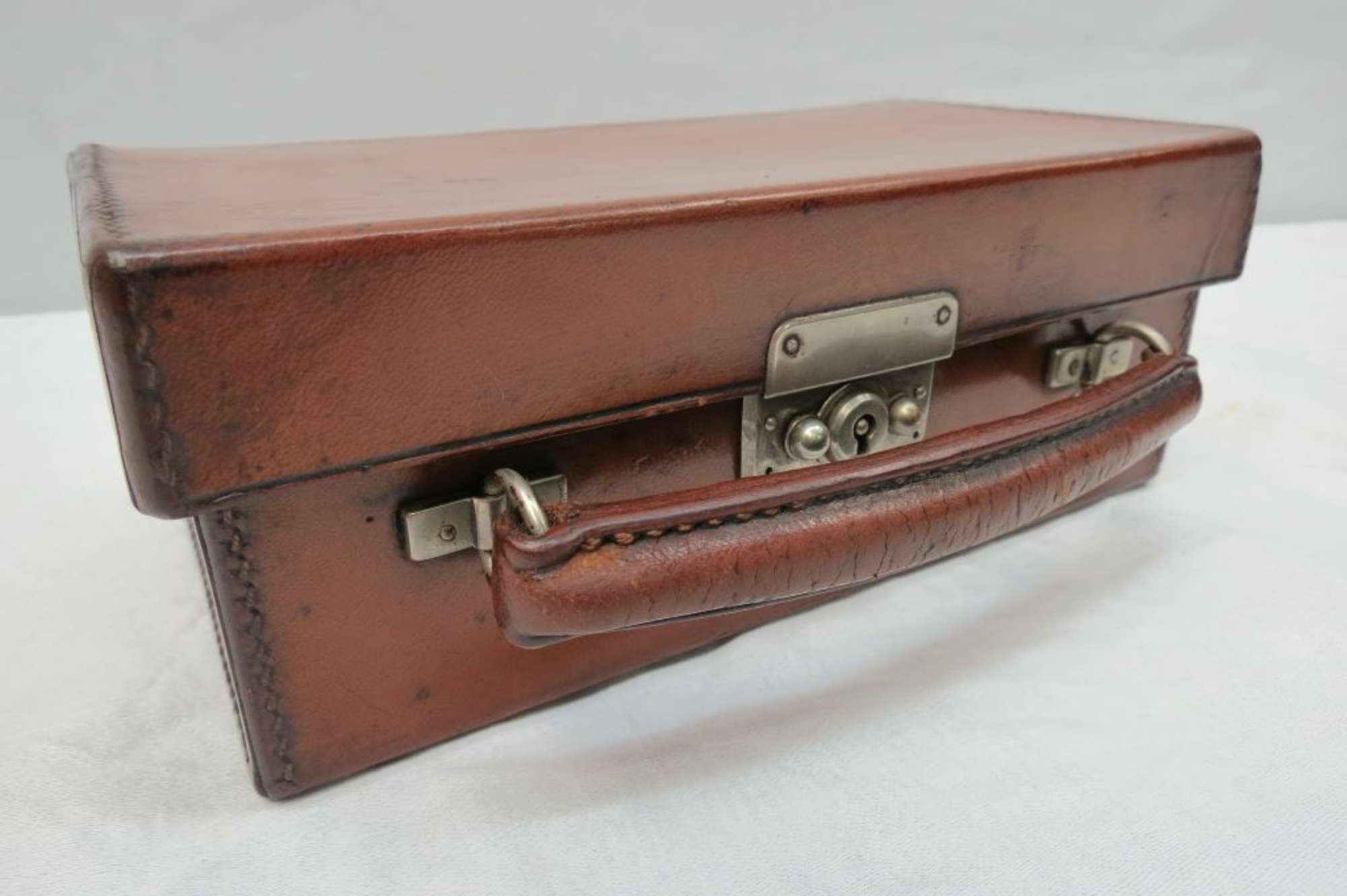 A miniature Leather Case-Sold