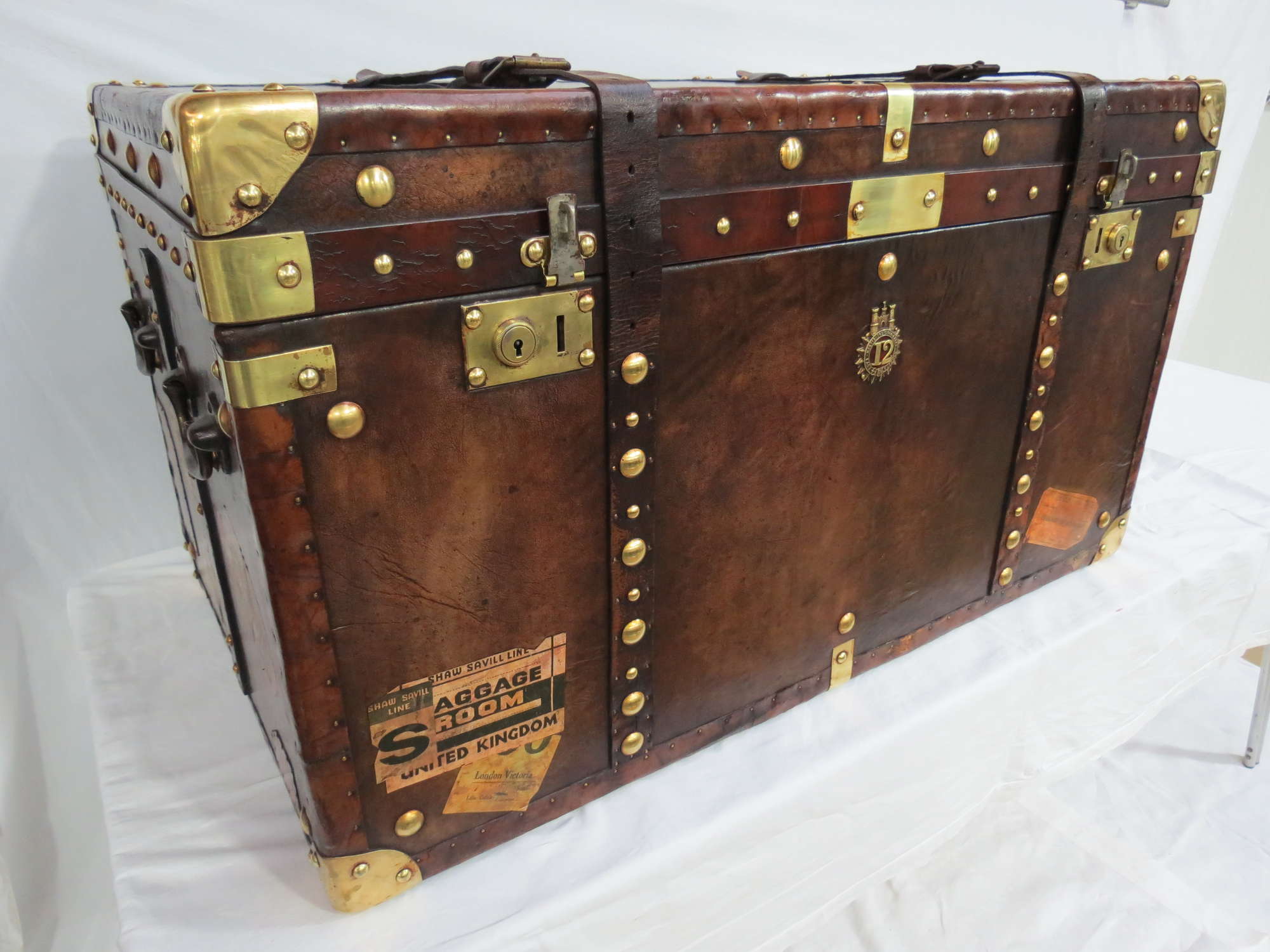 A large Army & Navy leather covered Travel Trunk -Sold