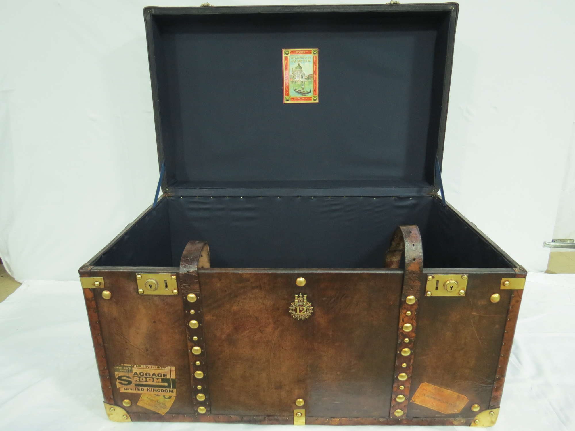 A large Army & Navy leather covered Travel Trunk -Sold