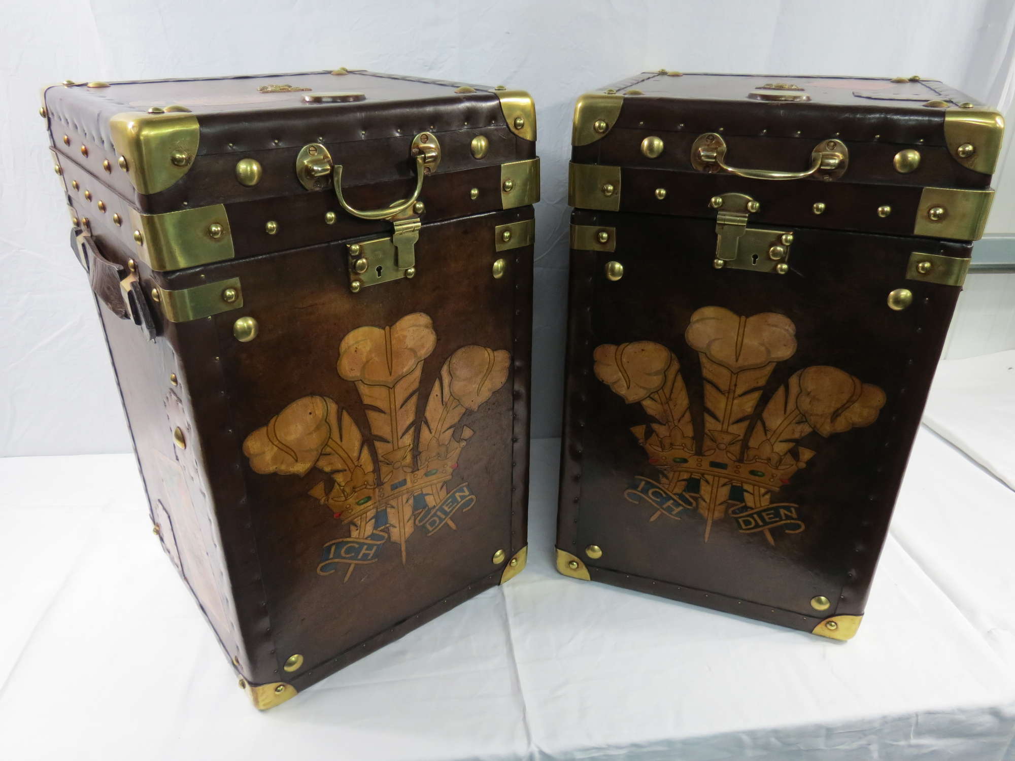 A pair of leather Army & Navy leather covered Travel Trunks-Sold