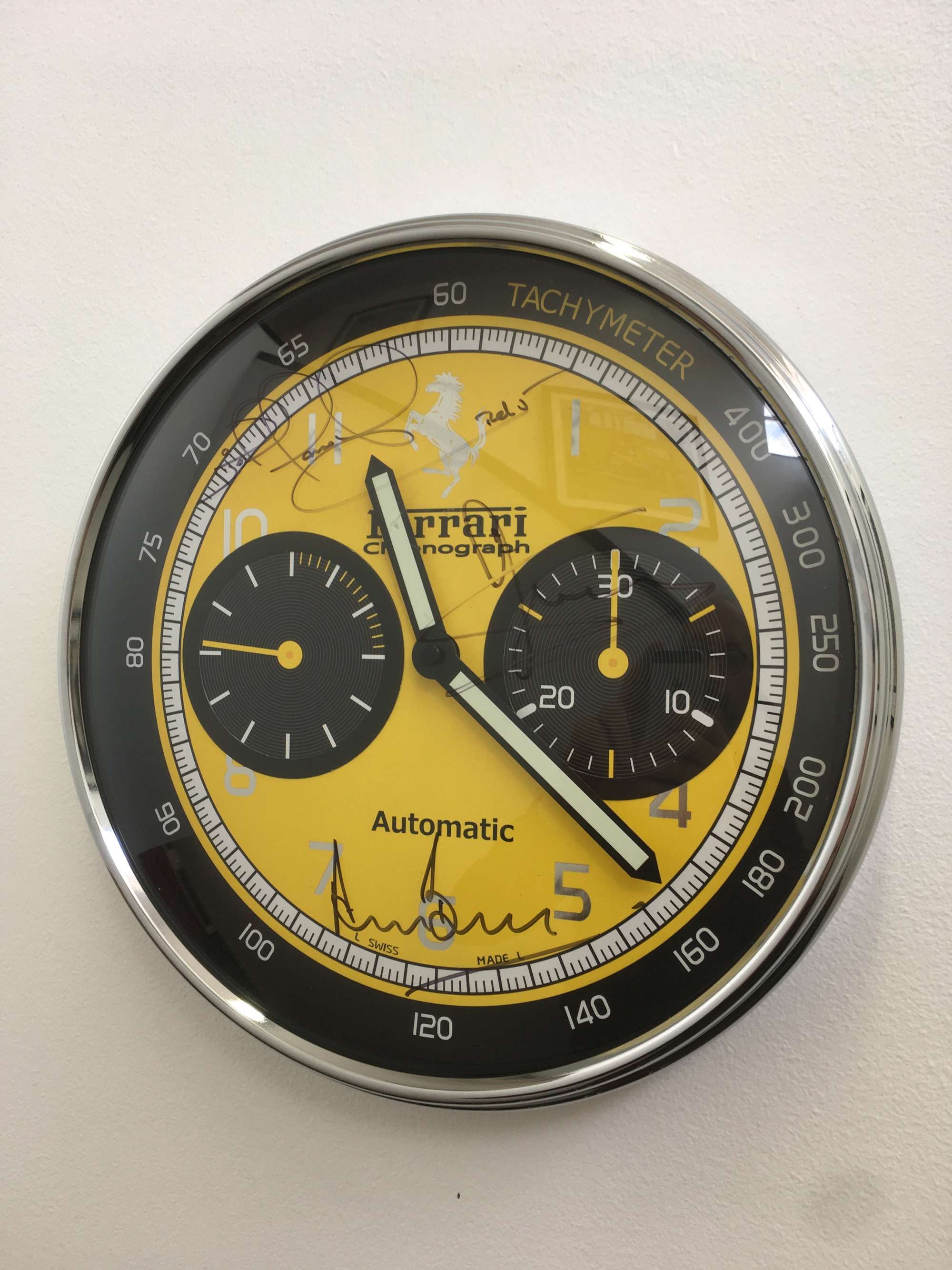 Ferrari Clock signed Scheckter, Bell and Mansell.-Sold