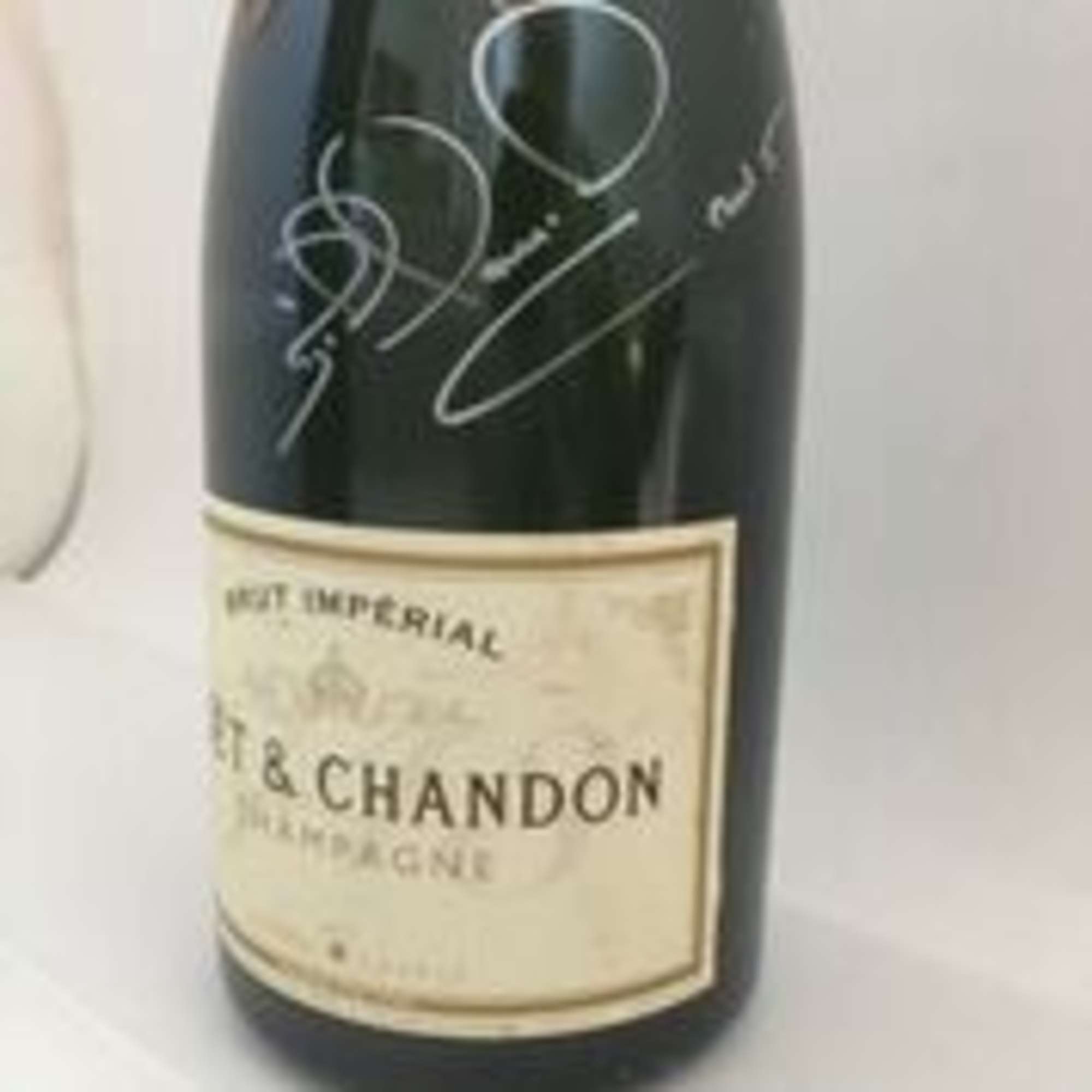 Champagne bottle, signed Nigel Mansell CBE-Sold