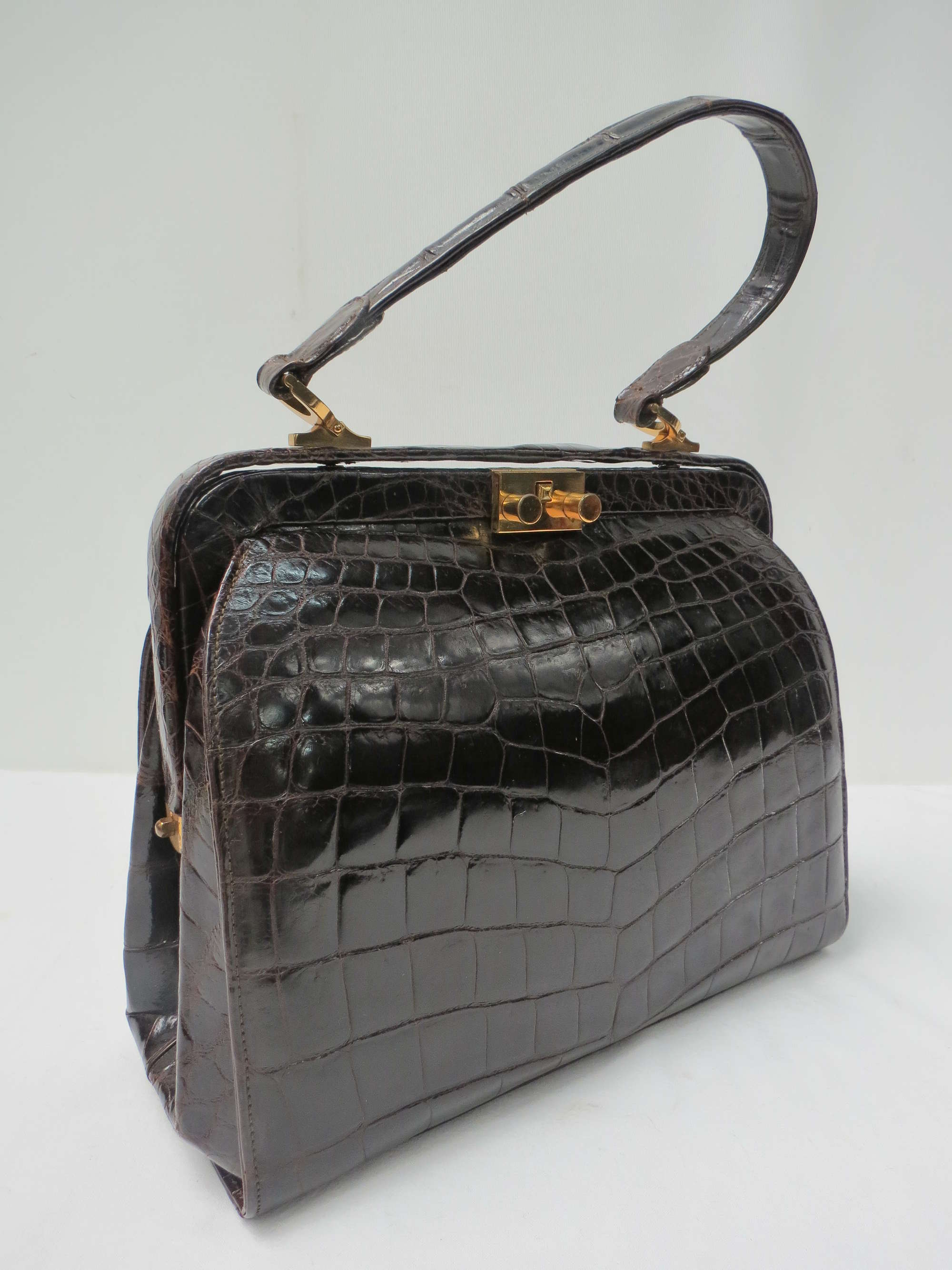 A very stylish dark tan crocodile skin handbag-Sold