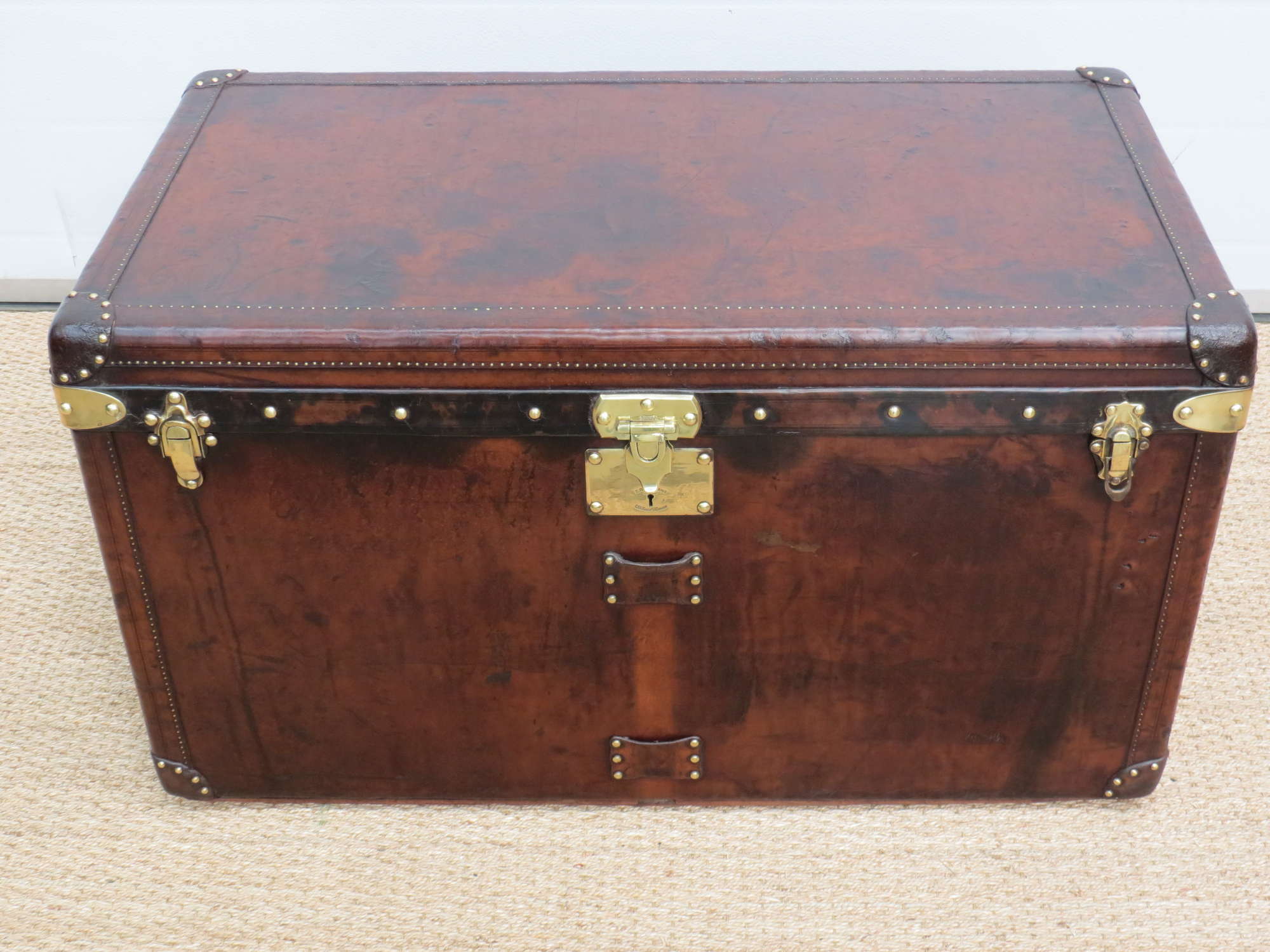 An exceptional leather covered 'steamer' travel trunk-Auction Lot