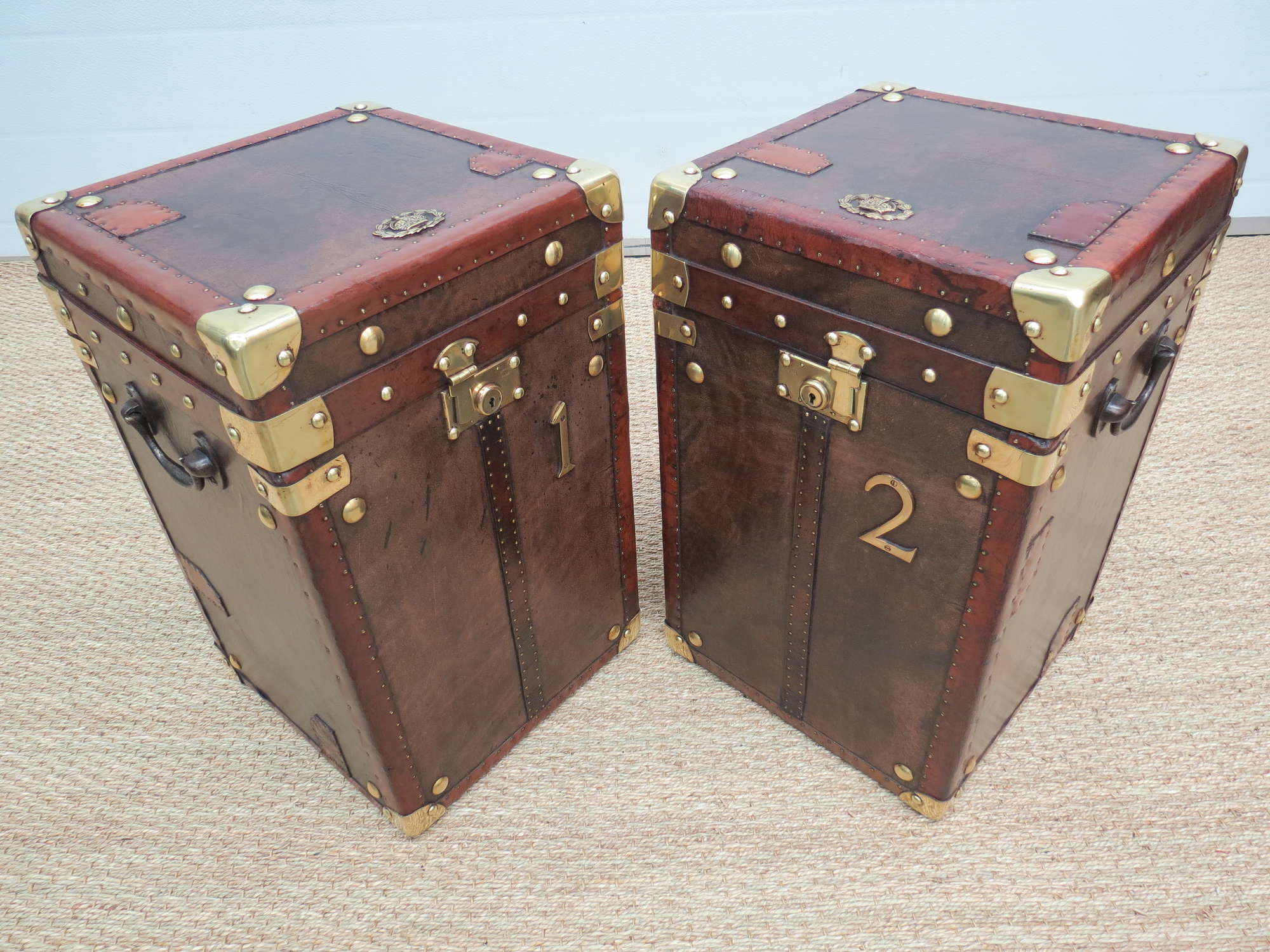 A pair of very smart Army and Navy leather travel trunks-Sold