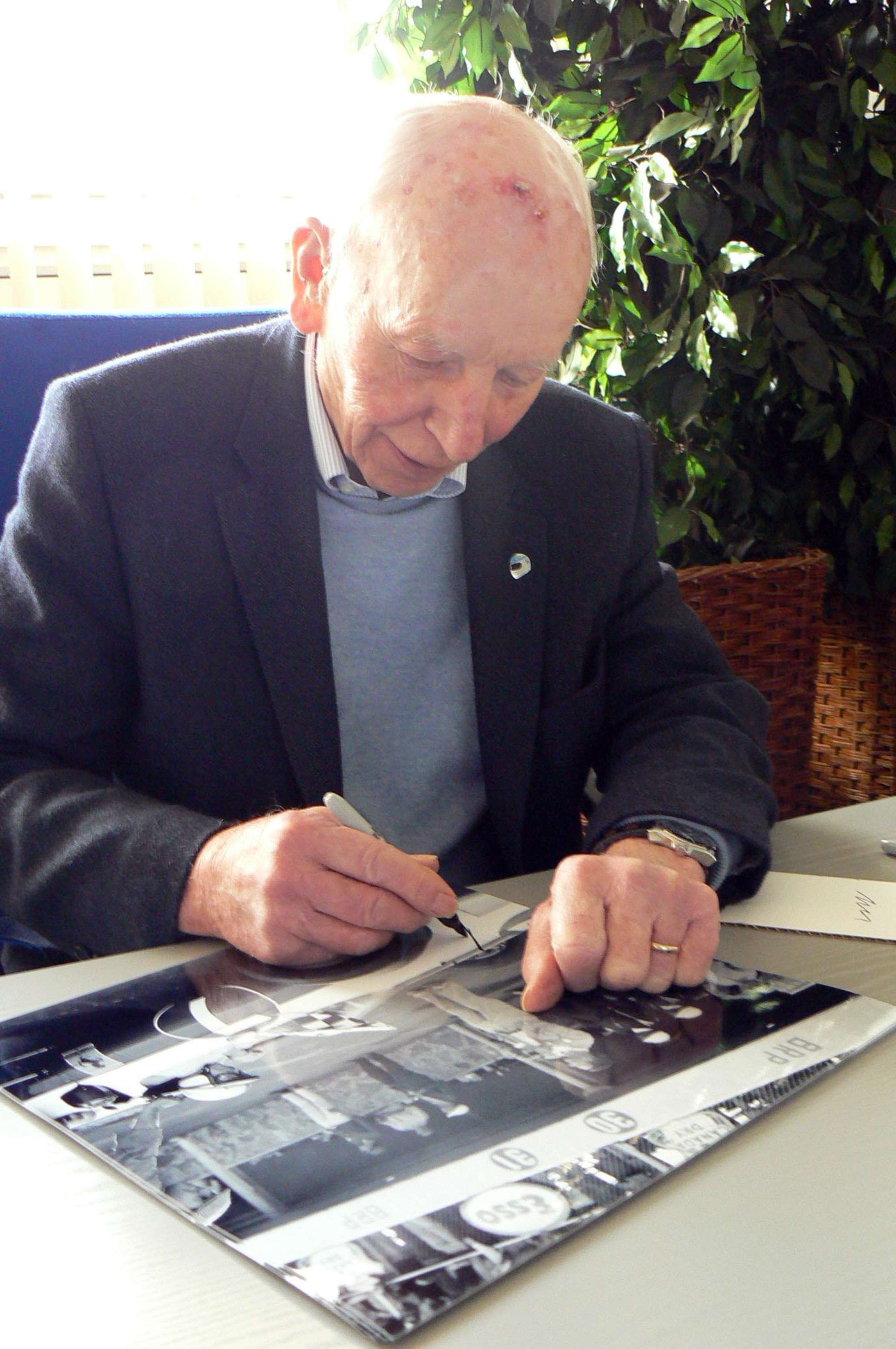  John Surtees. Signed Limited Edition Photo Making History. -Sold