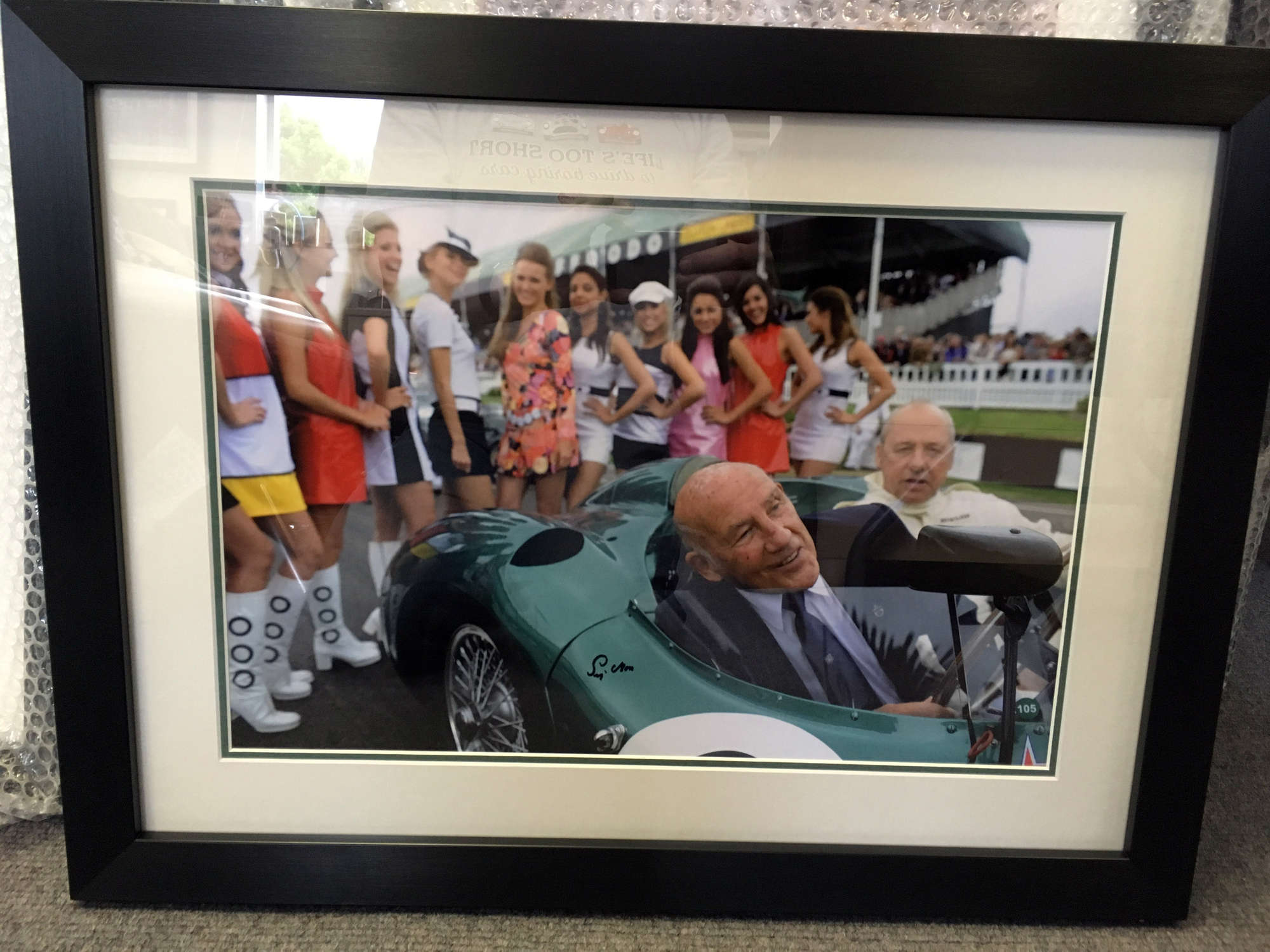 Aston, Stirling & The Girls, signed Sir Stirling Moss-Auction Lot