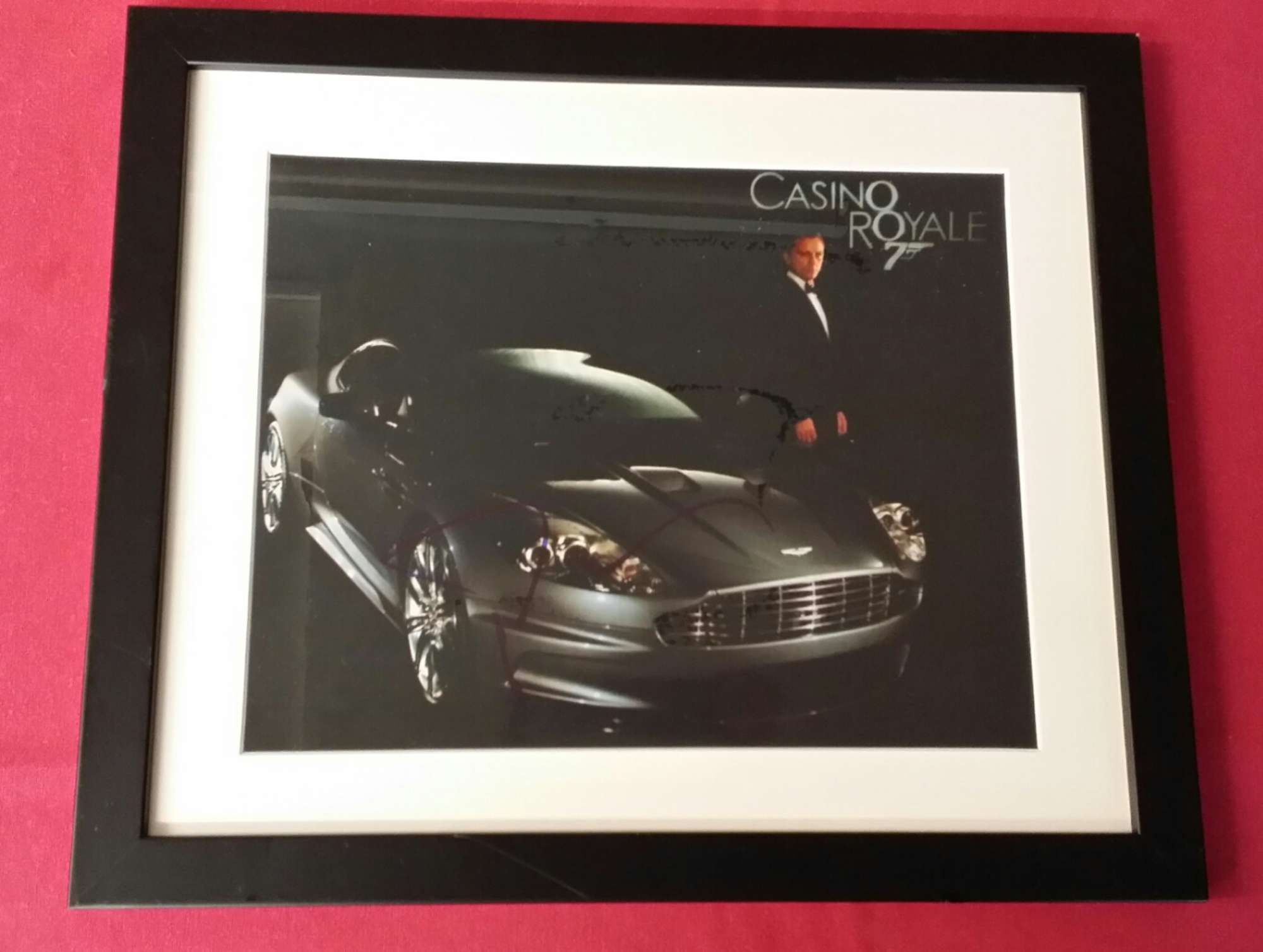 Signed Daniel Craig print with Aston Martin DBS V12-Sold