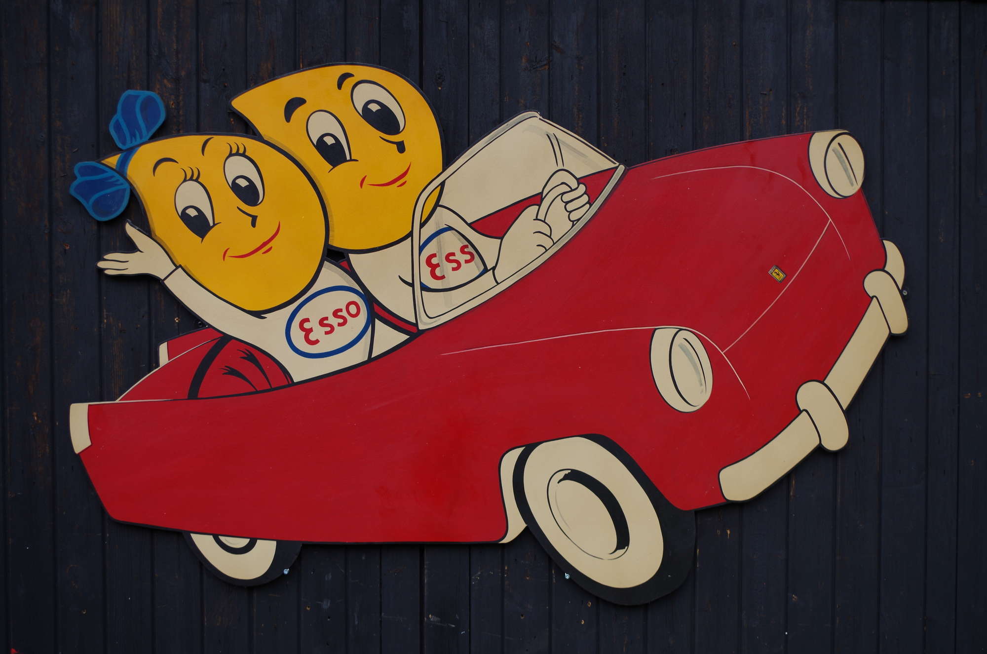 Mr and Mrs Drip in their little red convertible.-Sold