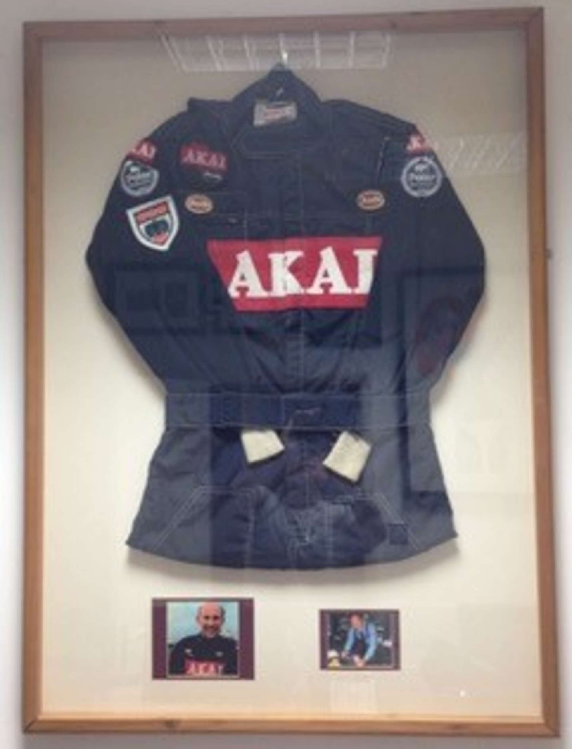 Sir Stirling Moss OBE signed race overalls  -Auction Lot