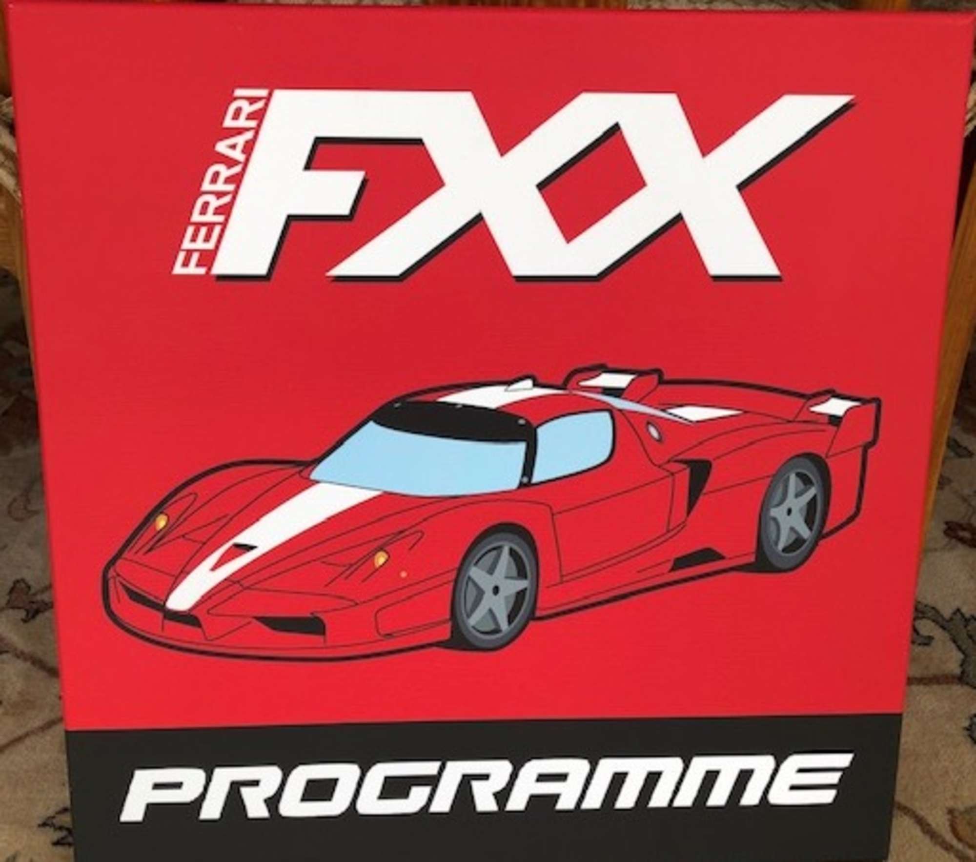 A Ferrari themed canvas of the FFX programme-Auction Lot