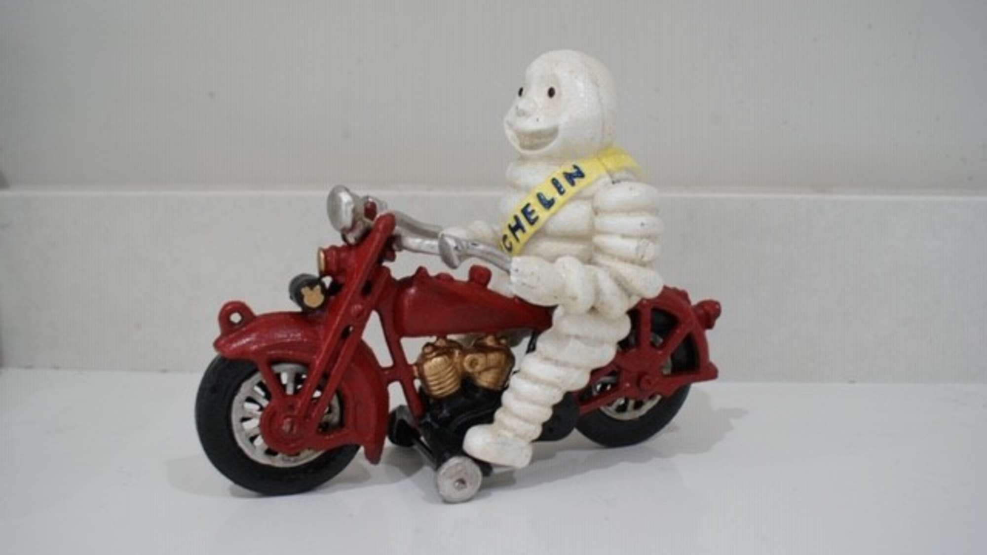Mr Bibendum Michelin figurine on motorcycle-Auction Lot