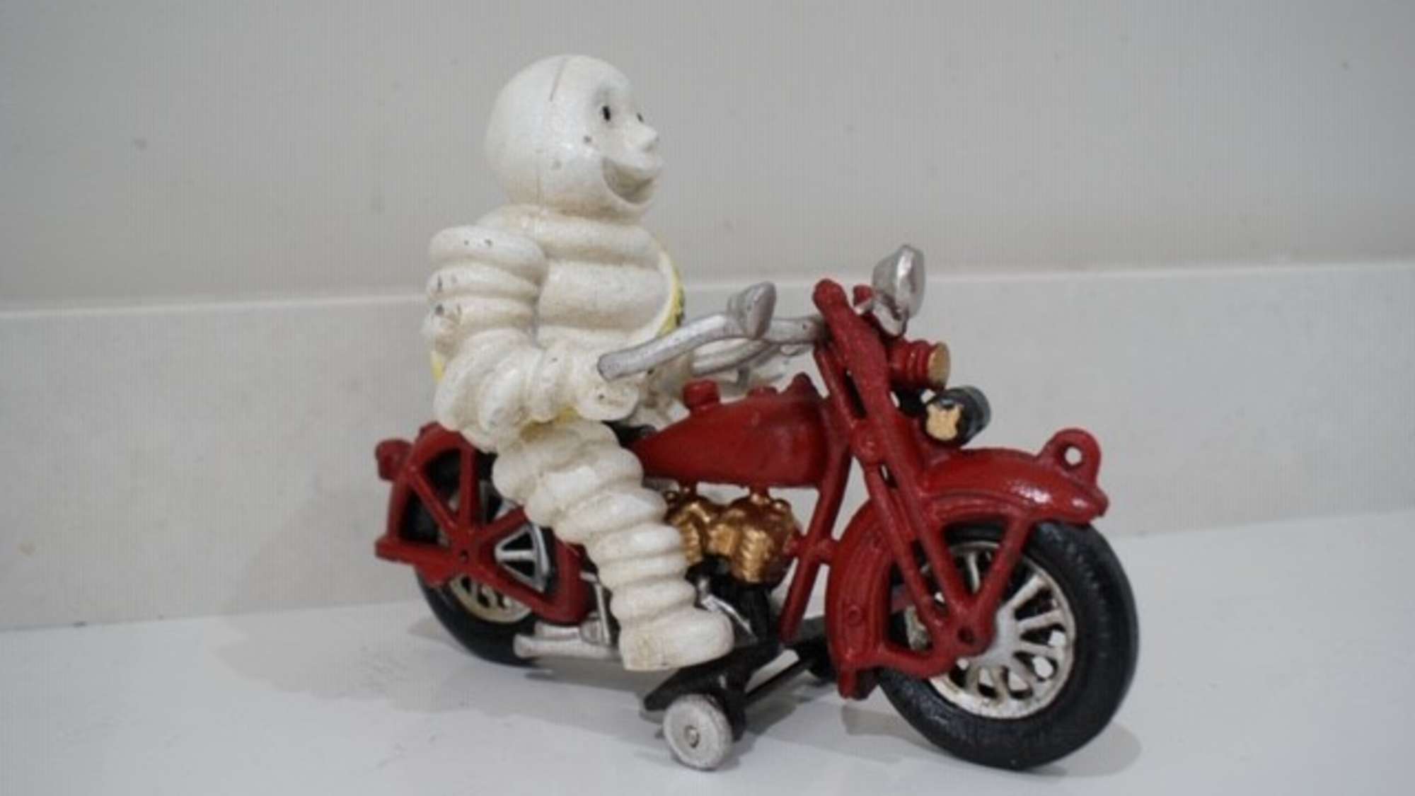 Mr Bibendum Michelin figurine on motorcycle-Auction Lot