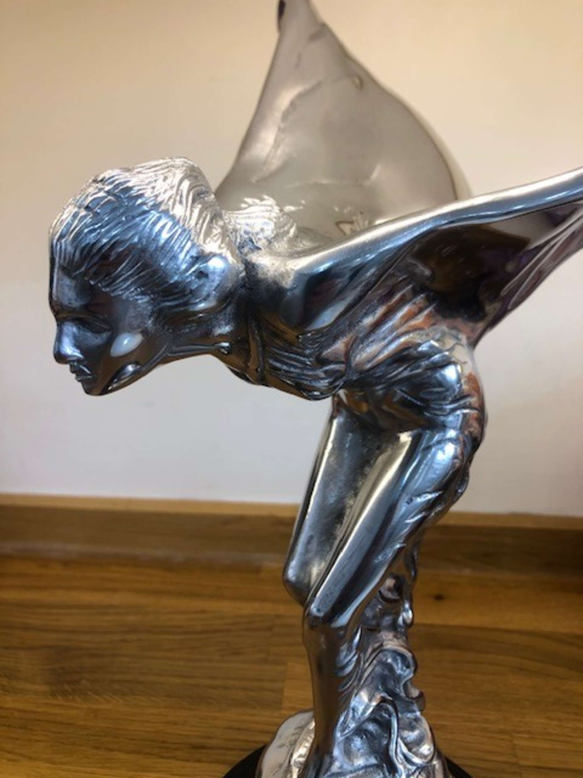 An over-sized cast metal and silvered statue of the Spirit o-Sold