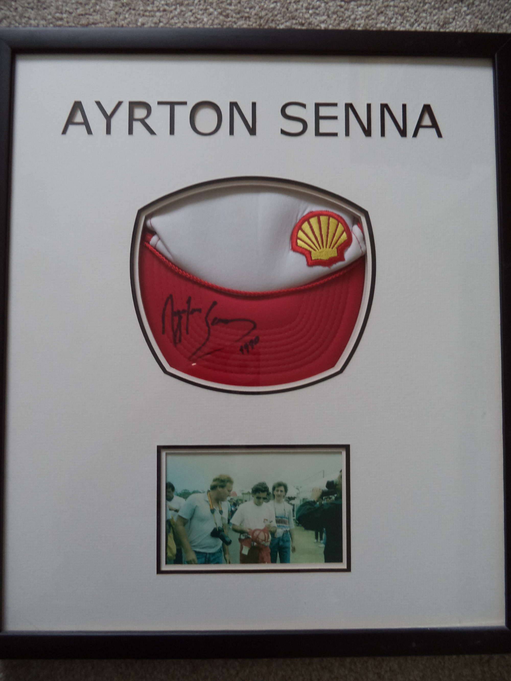 Framed 'Shell' cap hand-signed by Ayrton Senna-Sold