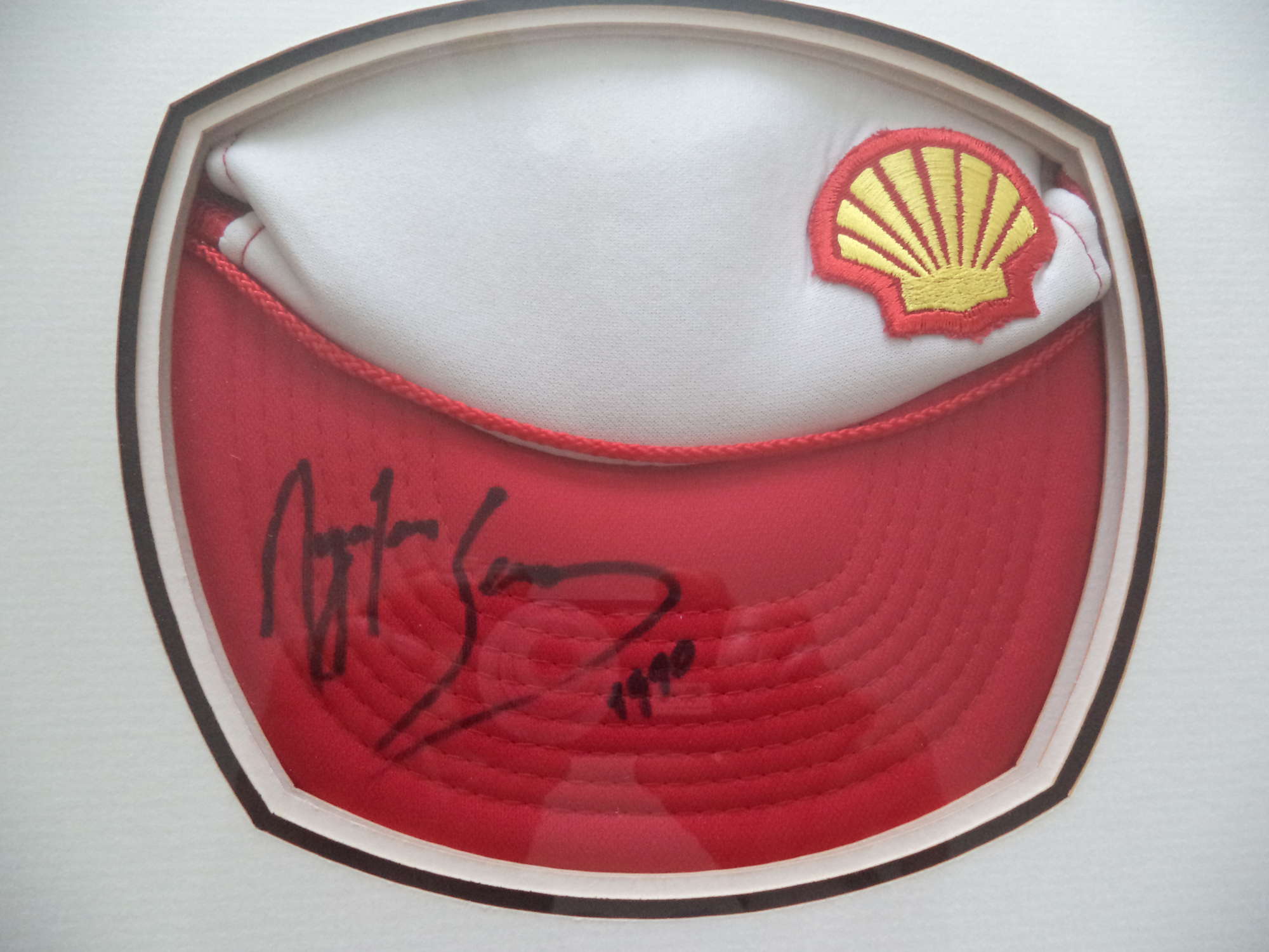Framed 'Shell' cap hand-signed by Ayrton Senna-Sold