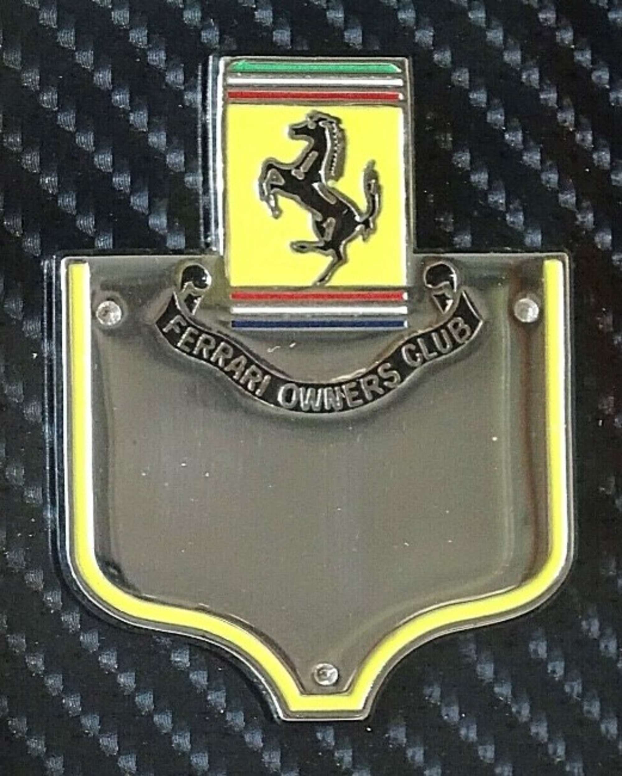 An enamelled-chrome Ferrari Owners' Club grille badge mounte-Sold