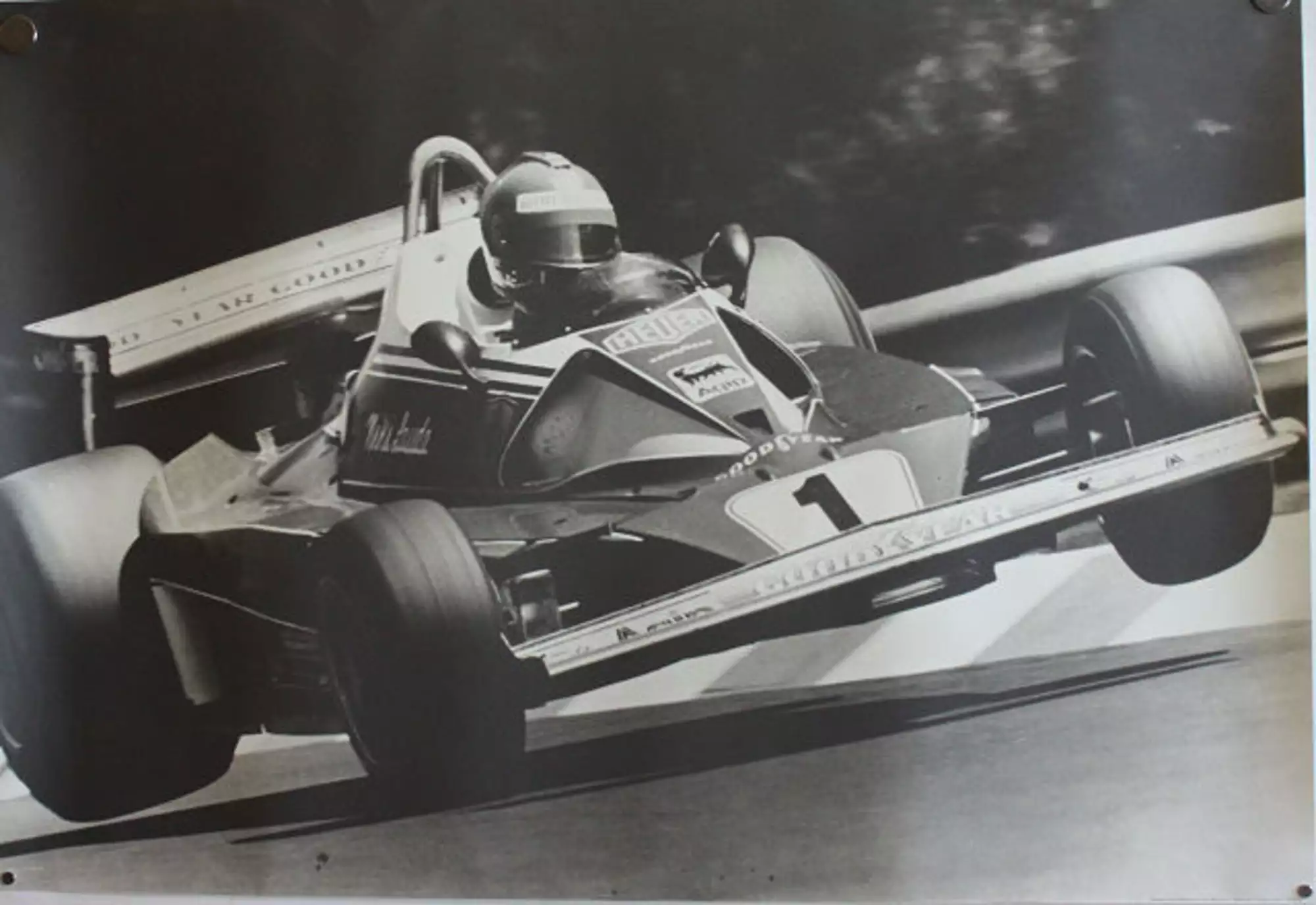 Seven Large Format Photographic Prints of Grand Prix Ferraris Through the Years