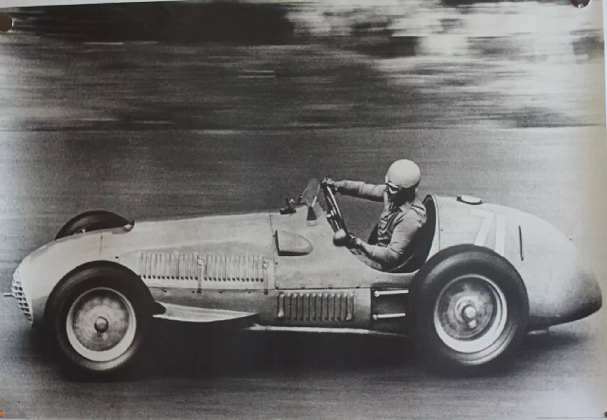 Seven Large Format Photographic Prints of Grand Prix Ferraris Through the Years