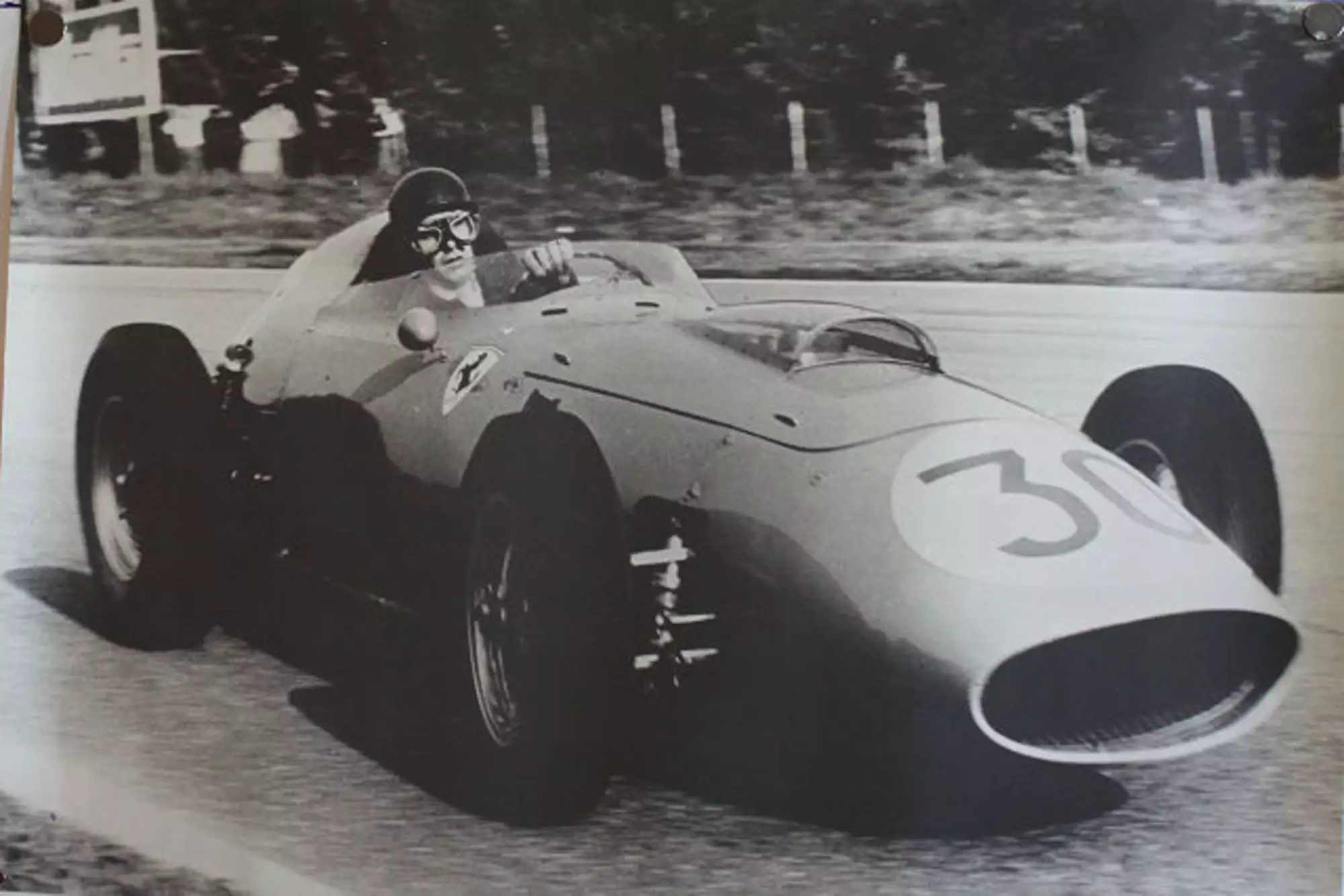 Seven Large Format Photographic Prints of Grand Prix Ferraris Through the Years