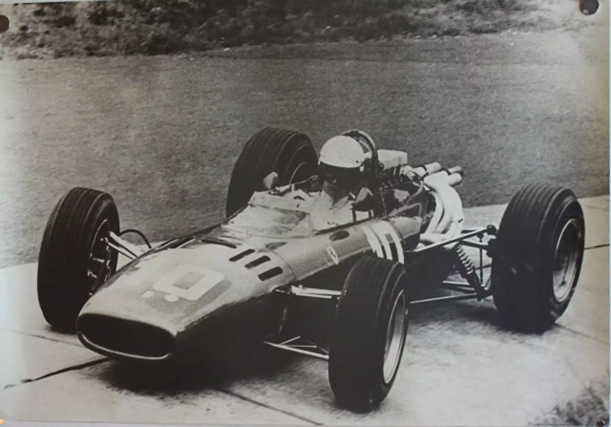 Seven Large Format Photographic Prints of Grand Prix Ferraris Through the Years