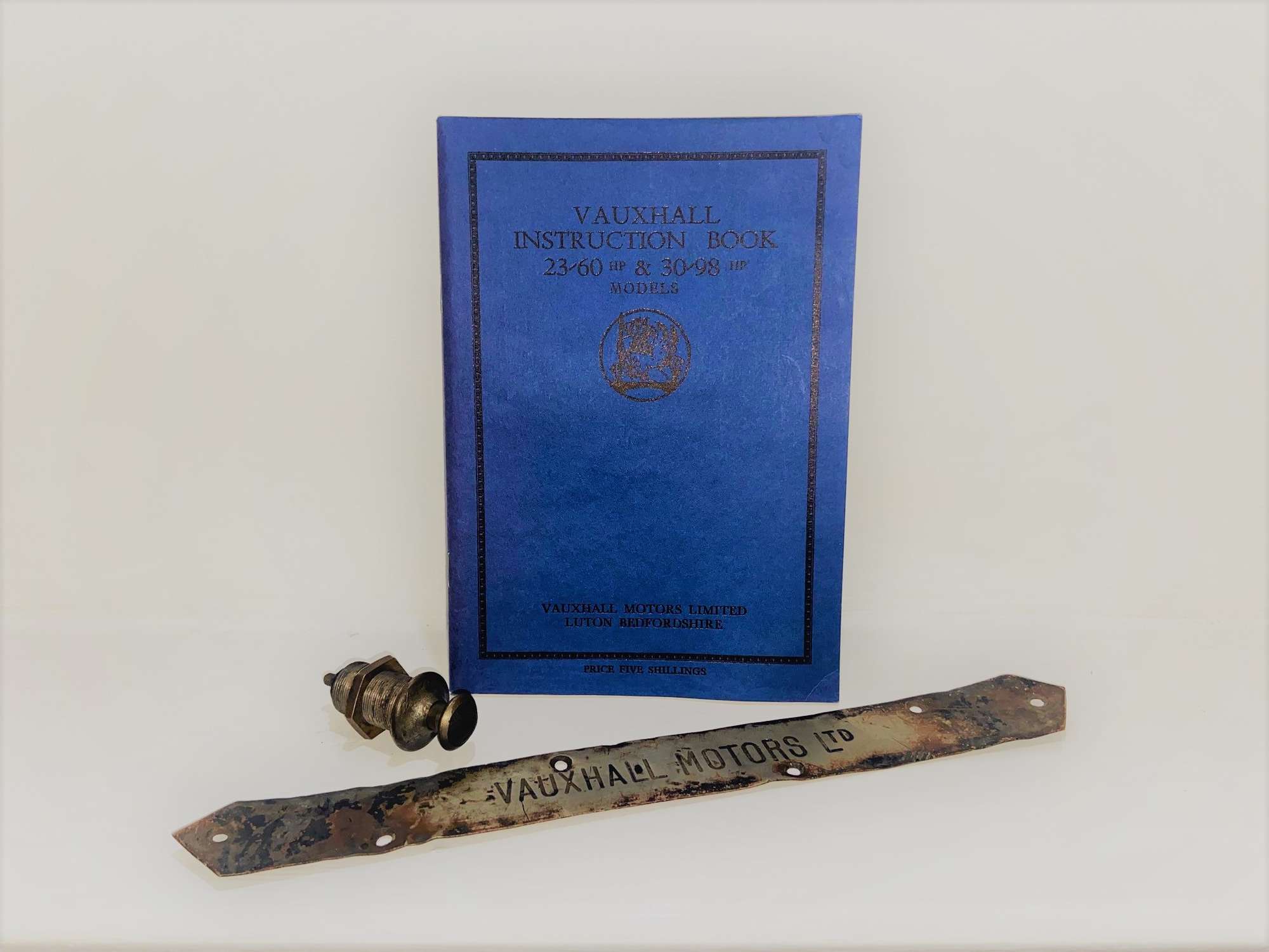 A Vauxhall Instruction Book for 23-60 & 30-98 models, CAV Magneto Switch and coachwork plate