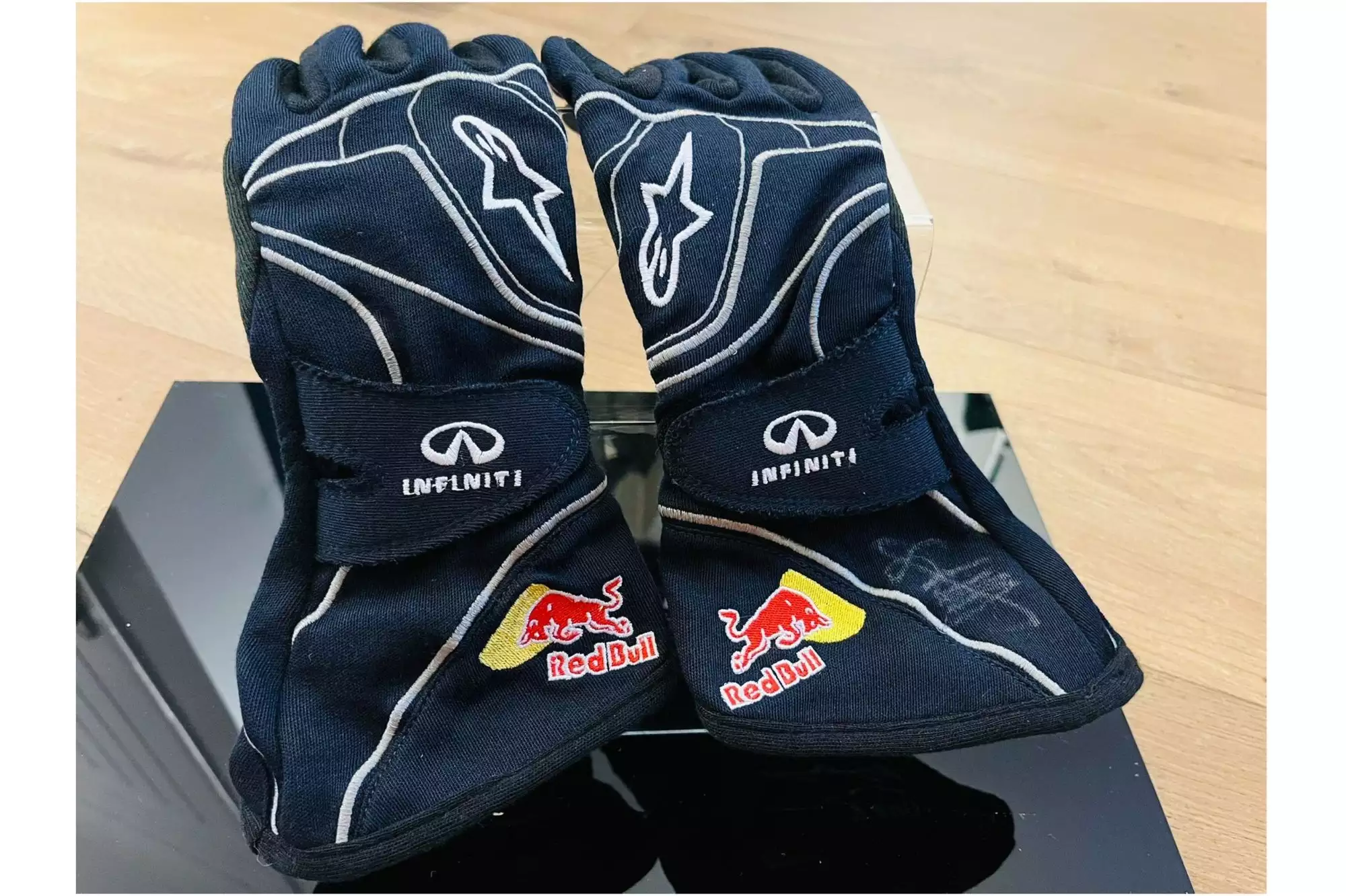 A Pair of Red Bull Gloves signed by Sebastian Vettel