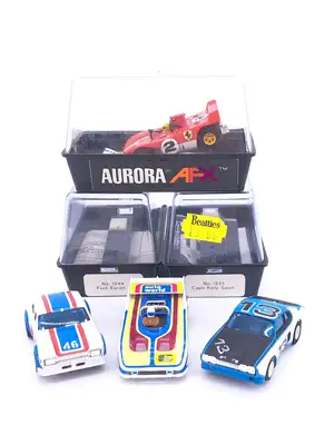 Aurora AFX, a boxed group of slot cars. Including an Aurora AFX No.1944 Ford Escort and No.1935 Capri Rally Sport and others similar. Not checked for completen